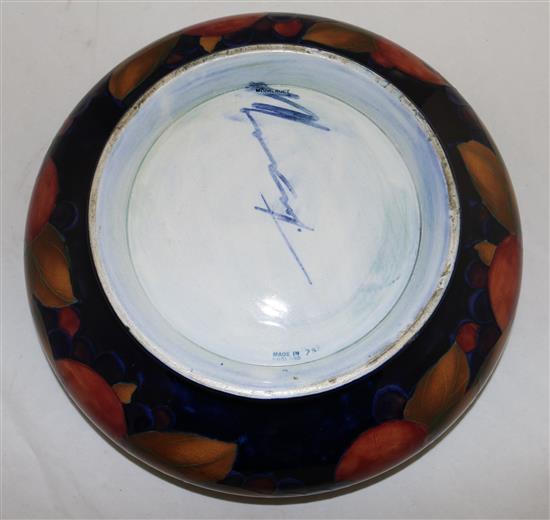 A William Moorcroft pomegranate blue ground footed shallow bowl, diameter 29cm